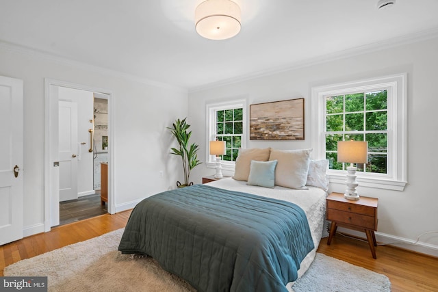 2723 Washington Ave, Chevy Chase, MD 20815 - bedroom with crown molding, wood finished floors, and connected bathroom