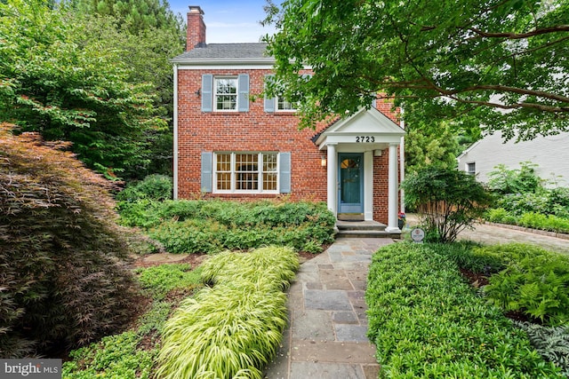2723 Washington Ave, Chevy Chase, MD 20815 - colonial home with a chimney and brick siding