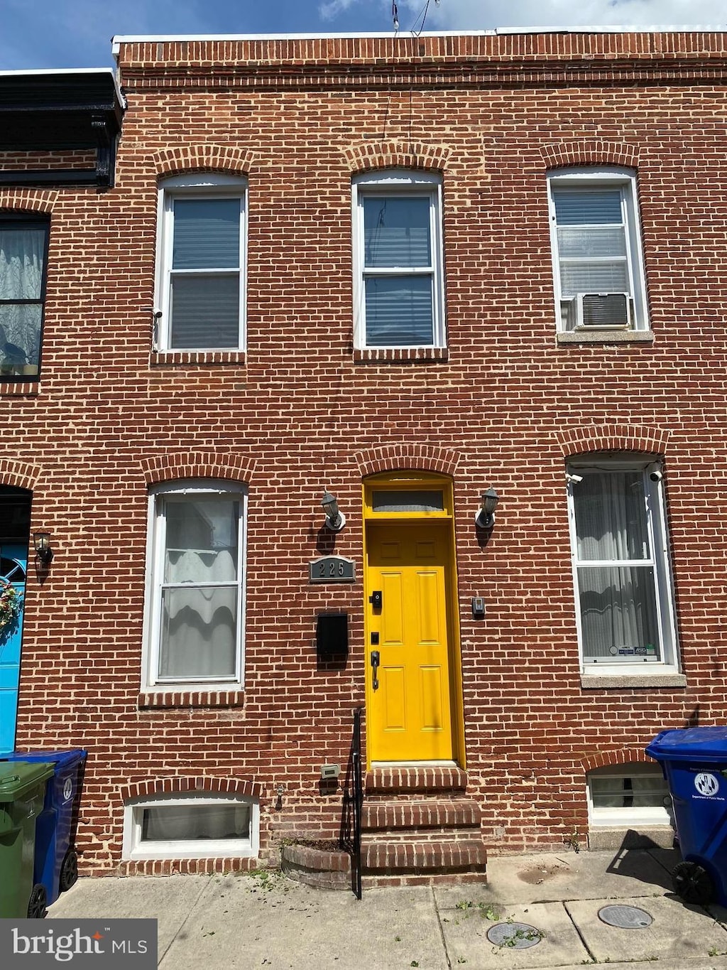 225 Madeira St N, Baltimore, MD 21231 - view of property with entry steps, brick siding, and cooling unit