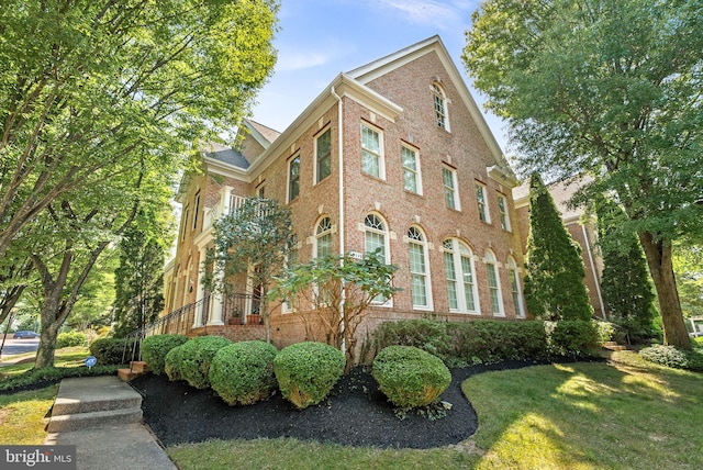 10111 Ballynahown Cir, Fairfax, VA 22030 - view of side of property featuring brick siding and a lawn