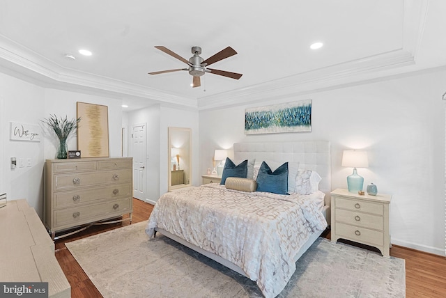 10111 Ballynahown Cir, Fairfax, VA 22030 - bedroom featuring a tray ceiling, wood finished floors, ornamental molding, recessed lighting, and a ceiling fan