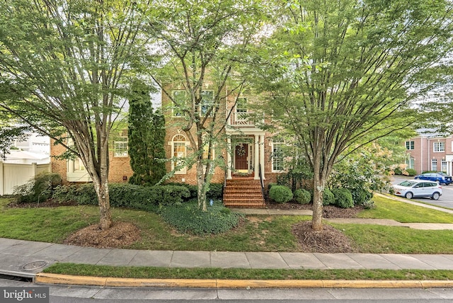10111 Ballynahown Cir, Fairfax, VA 22030 - view of property hidden behind natural elements featuring brick siding