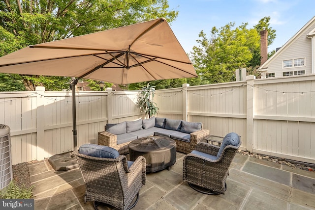 10111 Ballynahown Cir, Fairfax, VA 22030 - fenced backyard with outdoor lounge area and a patio