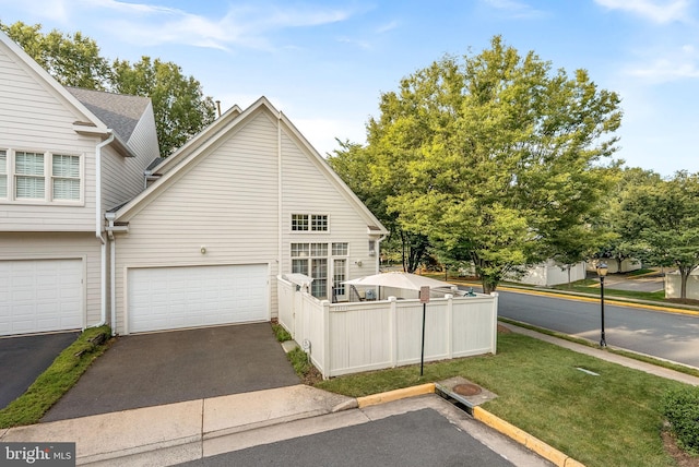 10111 Ballynahown Cir, Fairfax, VA 22030 - view of side of home with a garage and driveway