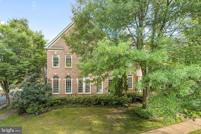 10111 Ballynahown Cir, Fairfax, VA 22030 - view of side of home featuring brick siding and a yard