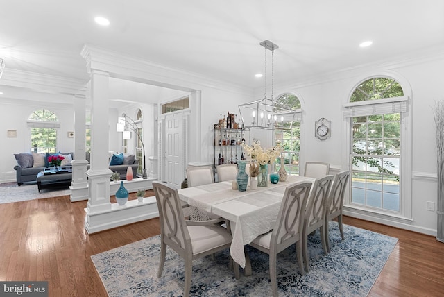10111 Ballynahown Cir, Fairfax, VA 22030 - dining space with wood finished floors, recessed lighting, ornamental molding, decorative columns, and a chandelier