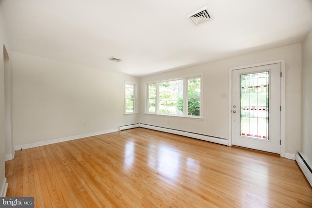 860 Temple Rd, Pottstown, PA 19465 - spare room featuring baseboard heating, light wood-type flooring, and a baseboard heating unit