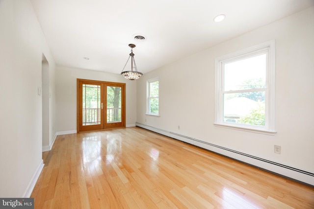 860 Temple Rd, Pottstown, PA 19465 - spare room featuring baseboard heating, light wood-style floors, a chandelier, and french doors