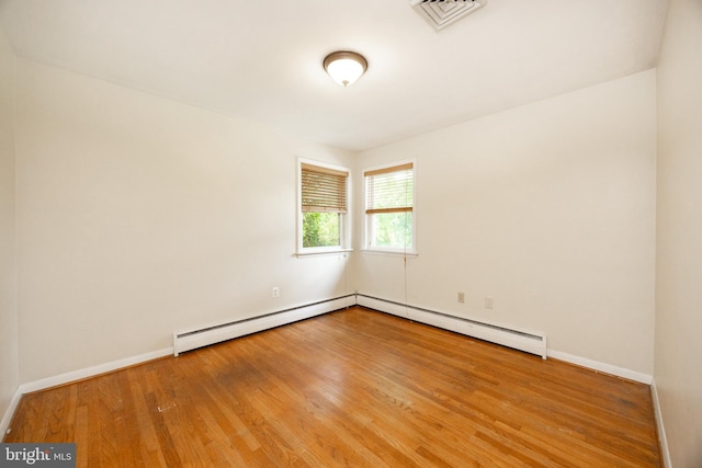 860 Temple Rd, Pottstown, PA 19465 - empty room with a baseboard radiator and wood finished floors