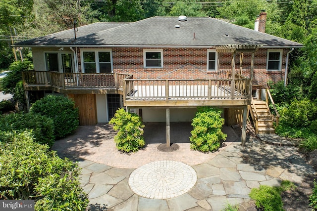 860 Temple Rd, Pottstown, PA 19465 - back of property featuring a shingled roof, a wooden deck, a chimney, brick siding, and stairway