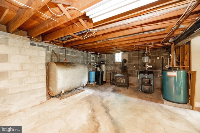 860 Temple Rd, Pottstown, PA 19465 - below grade area with oil tank, water heater, a wood stove, a heating unit, and a water softener