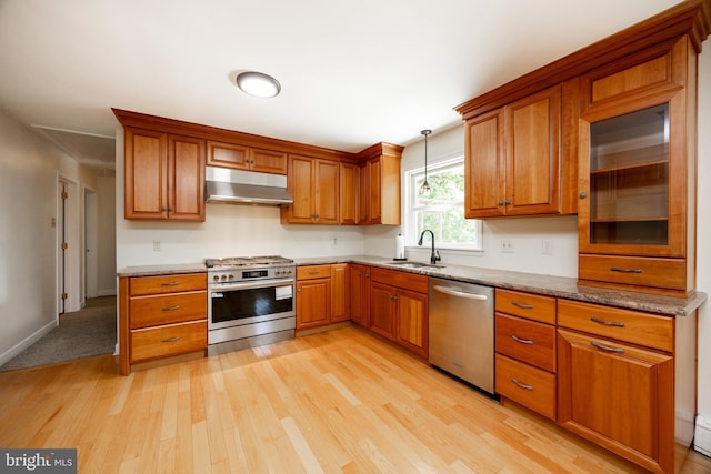 860 Temple Rd, Pottstown, PA 19465 - kitchen featuring appliances with stainless steel finishes, under cabinet range hood, light wood-style floors, and brown cabinetry