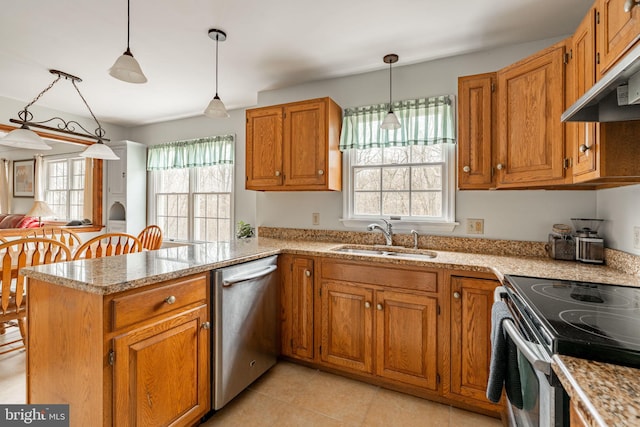 5 Charcoal Ln, Mohnton, PA 19540 - kitchen featuring appliances with stainless steel finishes, a peninsula, light countertops, and brown cabinets