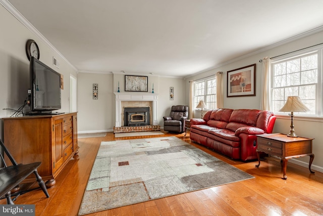 5 Charcoal Ln, Mohnton, PA 19540 - living area featuring light wood-style floors, ornamental molding, and a brick fireplace