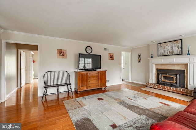 5 Charcoal Ln, Mohnton, PA 19540 - living room with crown molding, wood finished floors, and a brick fireplace