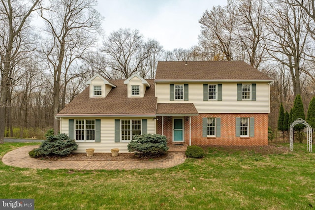 5 Charcoal Ln, Mohnton, PA 19540 - view of front of house with a shingled roof, a front lawn, and brick siding