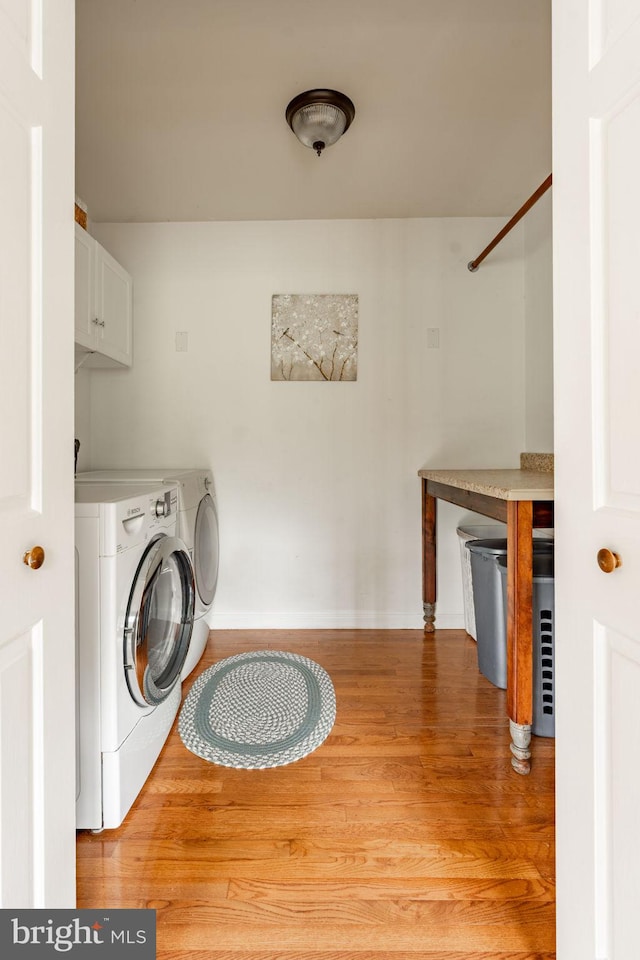 5 Charcoal Ln, Mohnton, PA 19540 - laundry area featuring light wood-type flooring, washer and dryer, and cabinet space