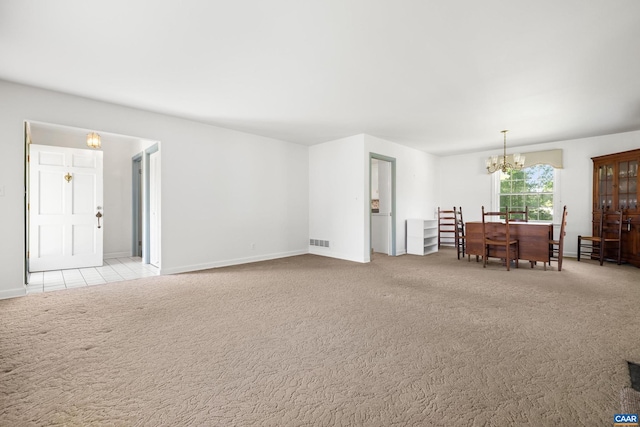 608 Davis Ave, Charlottesville, VA 22901 - carpeted living area featuring a chandelier and baseboards