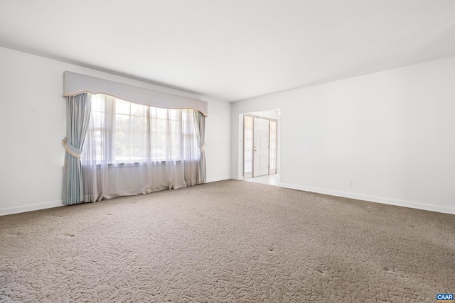 608 Davis Ave, Charlottesville, VA 22901 - carpeted spare room featuring baseboards