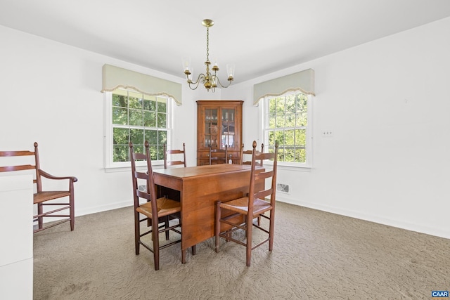 608 Davis Ave, Charlottesville, VA 22901 - dining room featuring a chandelier, carpet, and plenty of natural light