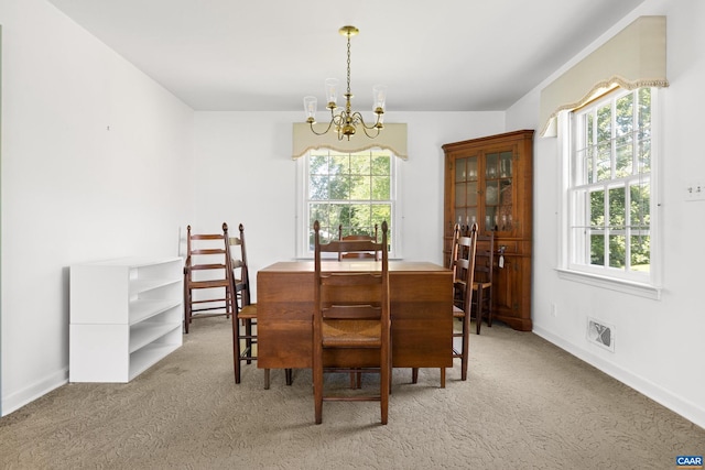 608 Davis Ave, Charlottesville, VA 22901 - carpeted dining area with a chandelier and plenty of natural light