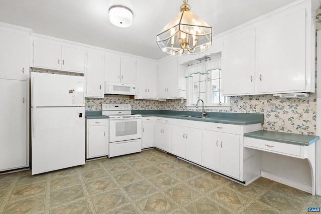 608 Davis Ave, Charlottesville, VA 22901 - kitchen with white appliances, a chandelier, white cabinetry, dark countertops, and hanging light fixtures