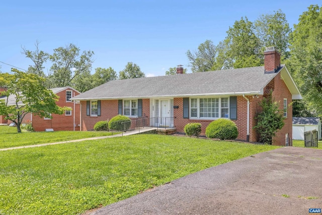 608 Davis Ave, Charlottesville, VA 22901 - ranch-style home featuring brick siding, a chimney, a front lawn, and roof with shingles
