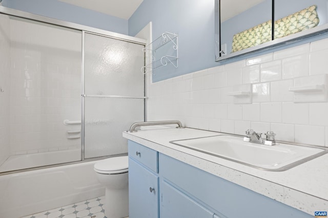 608 Davis Ave, Charlottesville, VA 22901 - bathroom with vanity, combined bath / shower with glass door, and tile walls