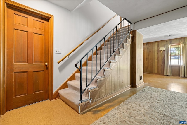 608 Davis Ave, Charlottesville, VA 22901 - stairs with baseboards and wood walls