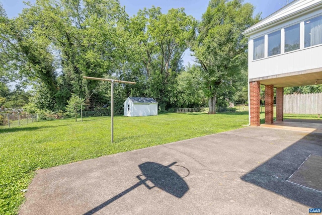 608 Davis Ave, Charlottesville, VA 22901 - fenced backyard featuring a shed, a carport, a patio area, and driveway