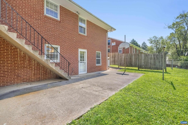 608 Davis Ave, Charlottesville, VA 22901 - rear view of property featuring stairway, a patio, and brick siding