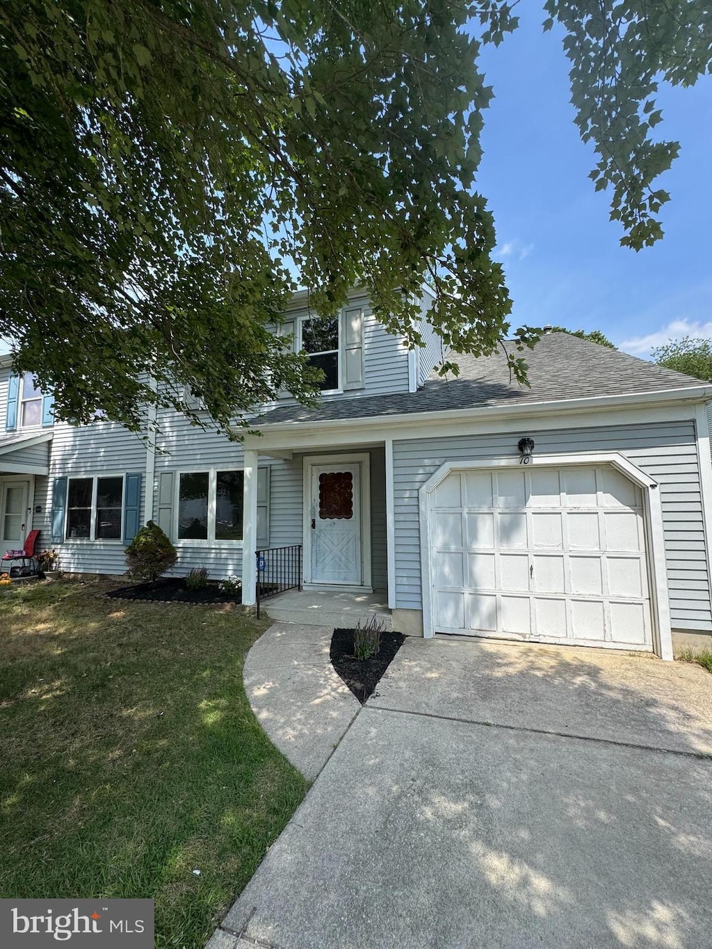 10 Woodmill Dr, Clementon, NJ 08021 - view of front of home with driveway, a garage, and a front lawn