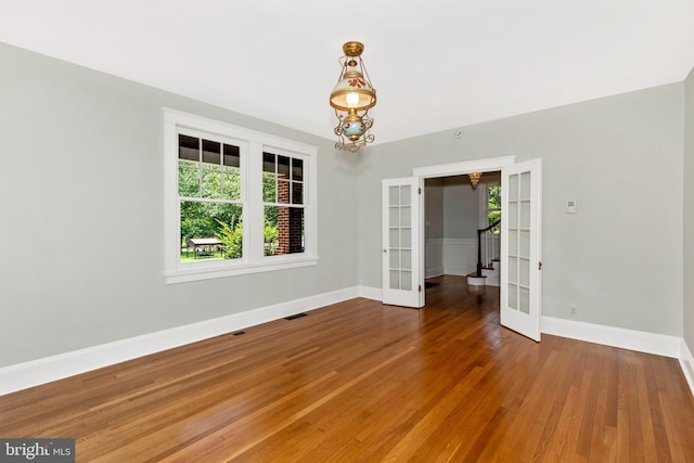 301 Fleming Ave, Frederick, MD 21701 - unfurnished room with french doors, plenty of natural light, and wood finished floors