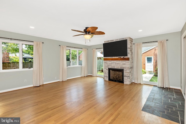 301 Fleming Ave, Frederick, MD 21701 - unfurnished living room featuring a ceiling fan, light wood-type flooring, a fireplace, and recessed lighting