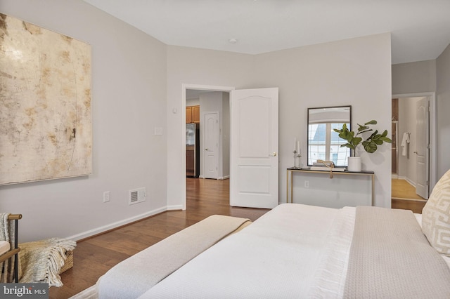 44357 Oakmont Manor Sq, Ashburn, VA 20147 - bedroom featuring freestanding refrigerator and wood finished floors