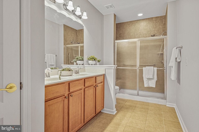 44357 Oakmont Manor Sq, Ashburn, VA 20147 - bathroom with double vanity, a stall shower, and tile patterned flooring
