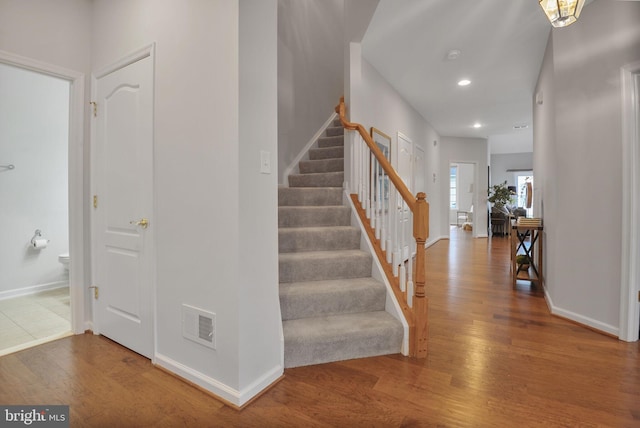 44357 Oakmont Manor Sq, Ashburn, VA 20147 - stairs featuring wood finished floors and recessed lighting