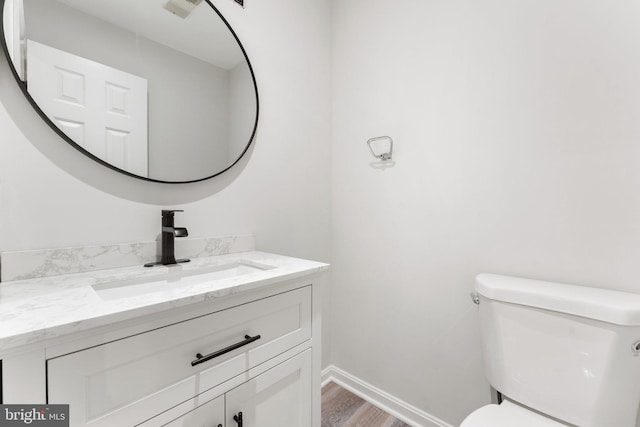 12560 Kempston Ln, Woodbridge, VA 22192 - half bath featuring vanity and wood finished floors