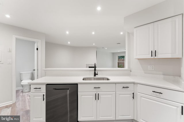 12560 Kempston Ln, Woodbridge, VA 22192 - kitchen with dishwasher, light wood-style flooring, white cabinetry, recessed lighting, and a peninsula