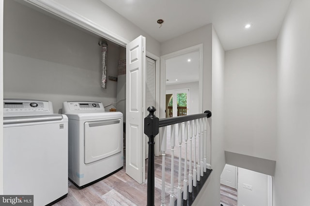 12560 Kempston Ln, Woodbridge, VA 22192 - washroom featuring separate washer and dryer, light wood-type flooring, and recessed lighting
