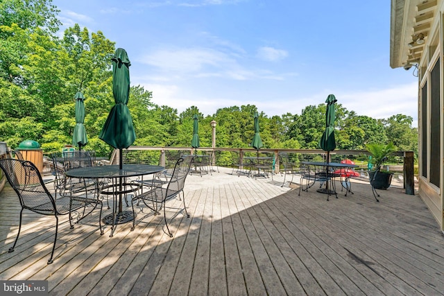 12560 Kempston Ln, Woodbridge, VA 22192 - wooden terrace with outdoor dining space and view of wooded area