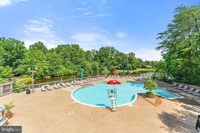 12560 Kempston Ln, Woodbridge, VA 22192 - community pool featuring a patio and view of wooded area