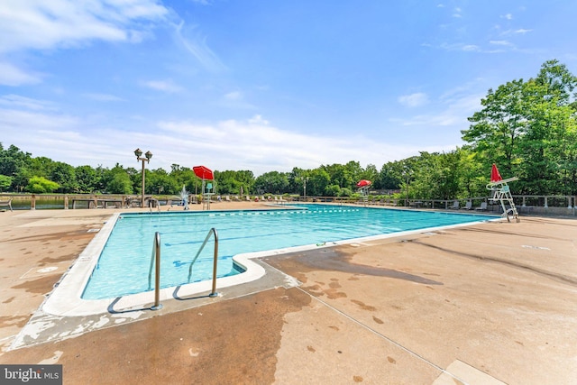 12560 Kempston Ln, Woodbridge, VA 22192 - community pool featuring view of wooded area and a patio