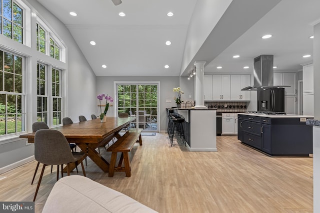13 Weirwood Rd, Wayne, PA 19087 - dining room with light wood-type flooring, recessed lighting, ornate columns, and high vaulted ceiling