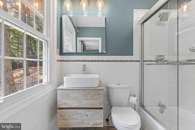13 Weirwood Rd, Wayne, PA 19087 - full bathroom featuring tile walls, combined bath / shower with glass door, and vanity