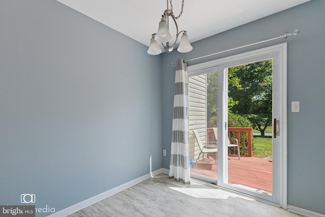 243 Prince William Way, Chalfont, PA 18914 - unfurnished dining area with a chandelier and wood finished floors