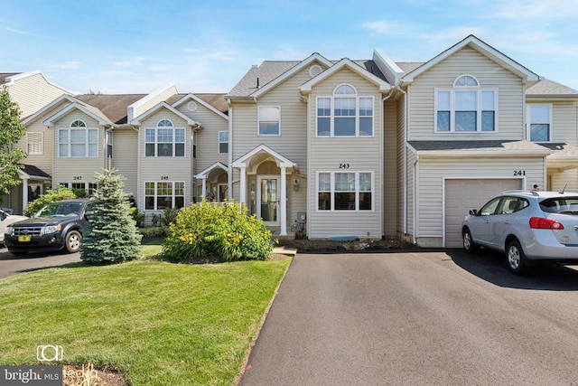243 Prince William Way, Chalfont, PA 18914 - townhome / multi-family property featuring a front yard, an attached garage, and driveway