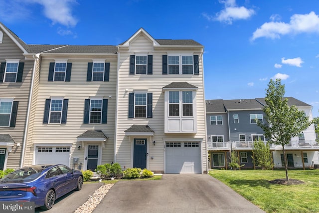 28 Boot Ln, Gilbertsville, PA 19525 - townhome / multi-family property featuring driveway, an attached garage, and a front yard
