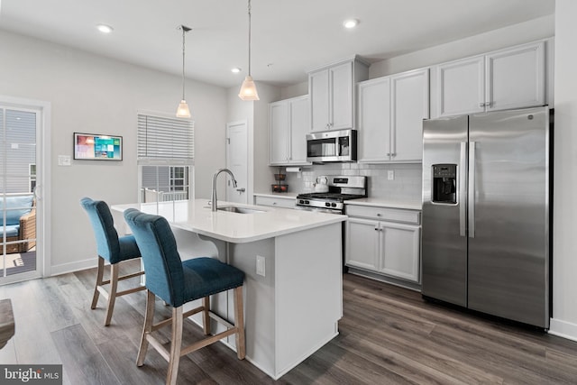 28 Boot Ln, Gilbertsville, PA 19525 - kitchen featuring appliances with stainless steel finishes, tasteful backsplash, dark wood finished floors, a kitchen island with sink, and recessed lighting