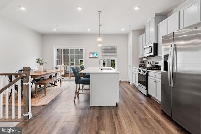 28 Boot Ln, Gilbertsville, PA 19525 - kitchen with stainless steel appliances, dark wood-style flooring, a center island with sink, light countertops, and recessed lighting